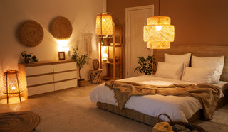 Cozy bedroom with warm lighting, bed, dresser, and decorative elements.